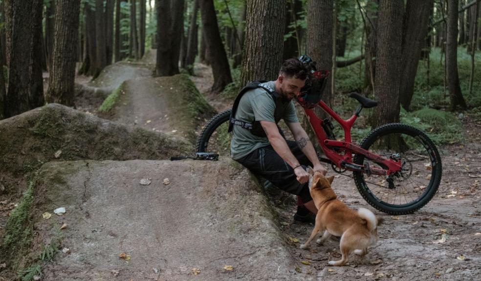 A cyclist with his dog A cyclist with his dog